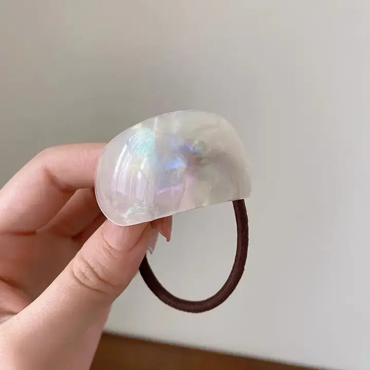White marble resin hair tie on a white background