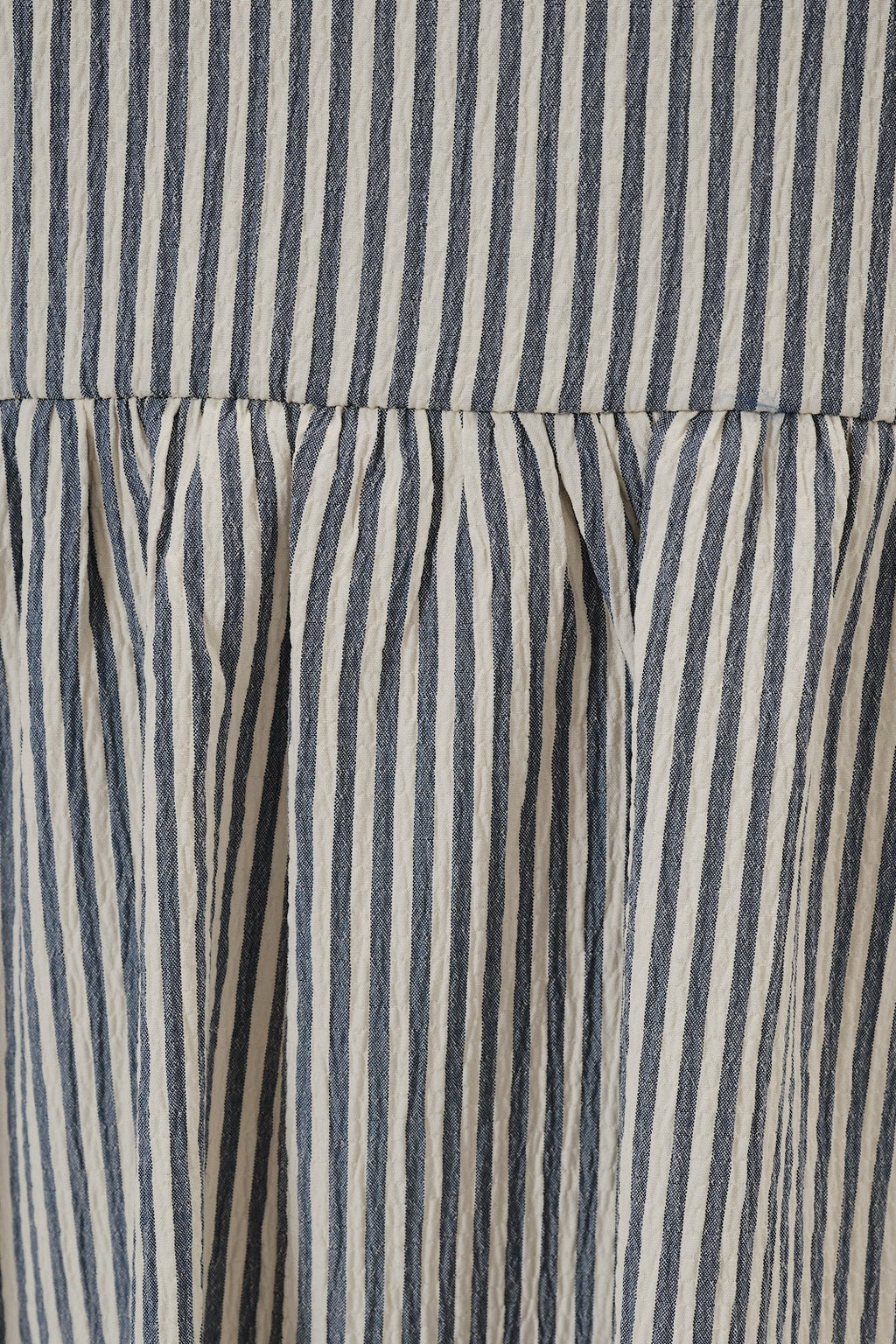 Close up of navy and ivory seersucker fabric