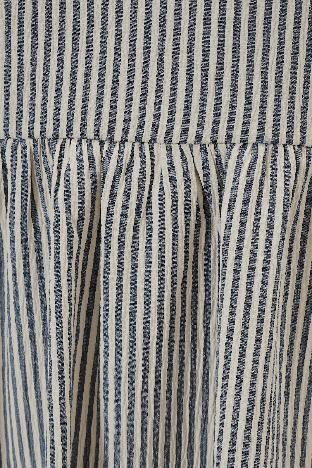 Close up of navy and ivory seersucker fabric