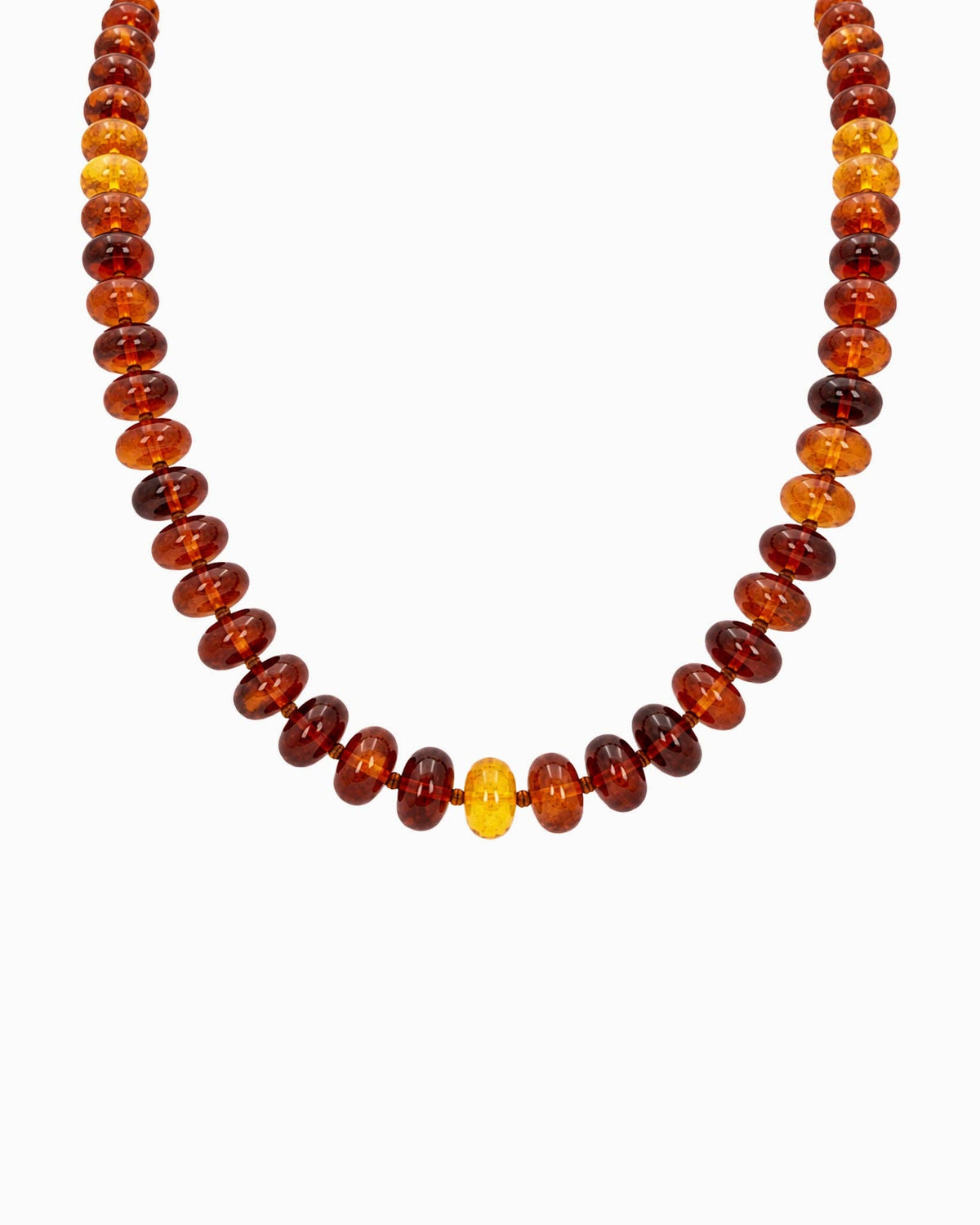 A beaded necklace featuring alternating marble brown beads with seed beads, displayed against a clean white background.
