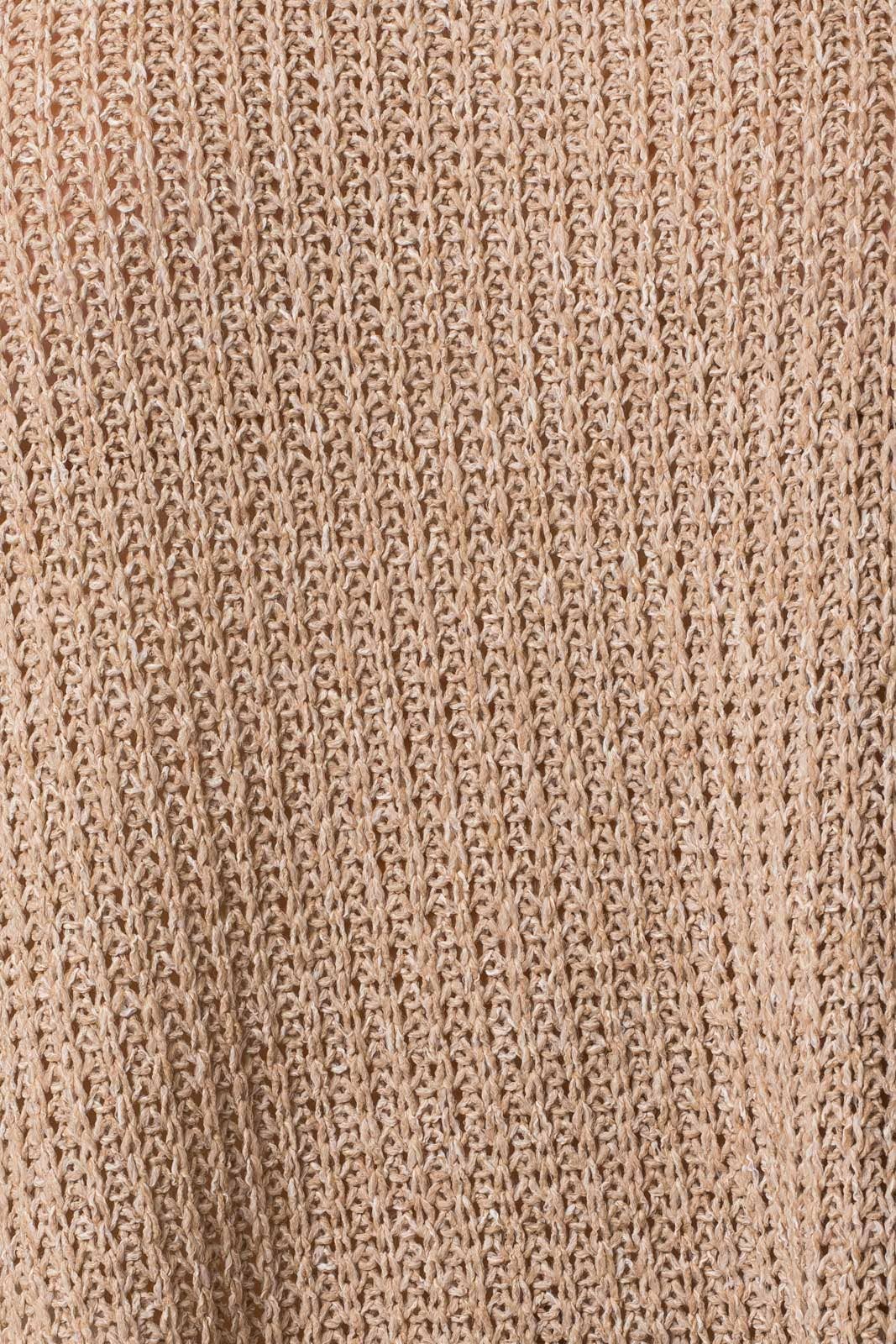 Close-up of taupe woven fabric texture of top with side slits