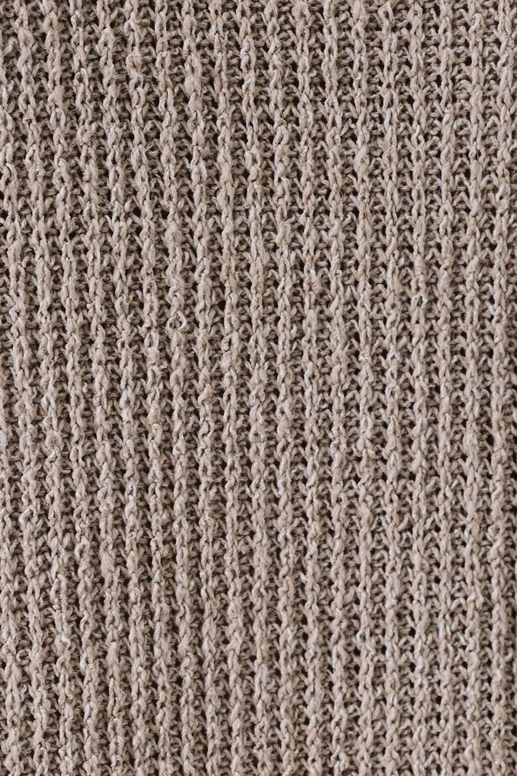 Close-up of a oatmeal boucle  fabric with a ribbed pattern