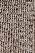 Close-up of a oatmeal boucle  fabric with a ribbed pattern