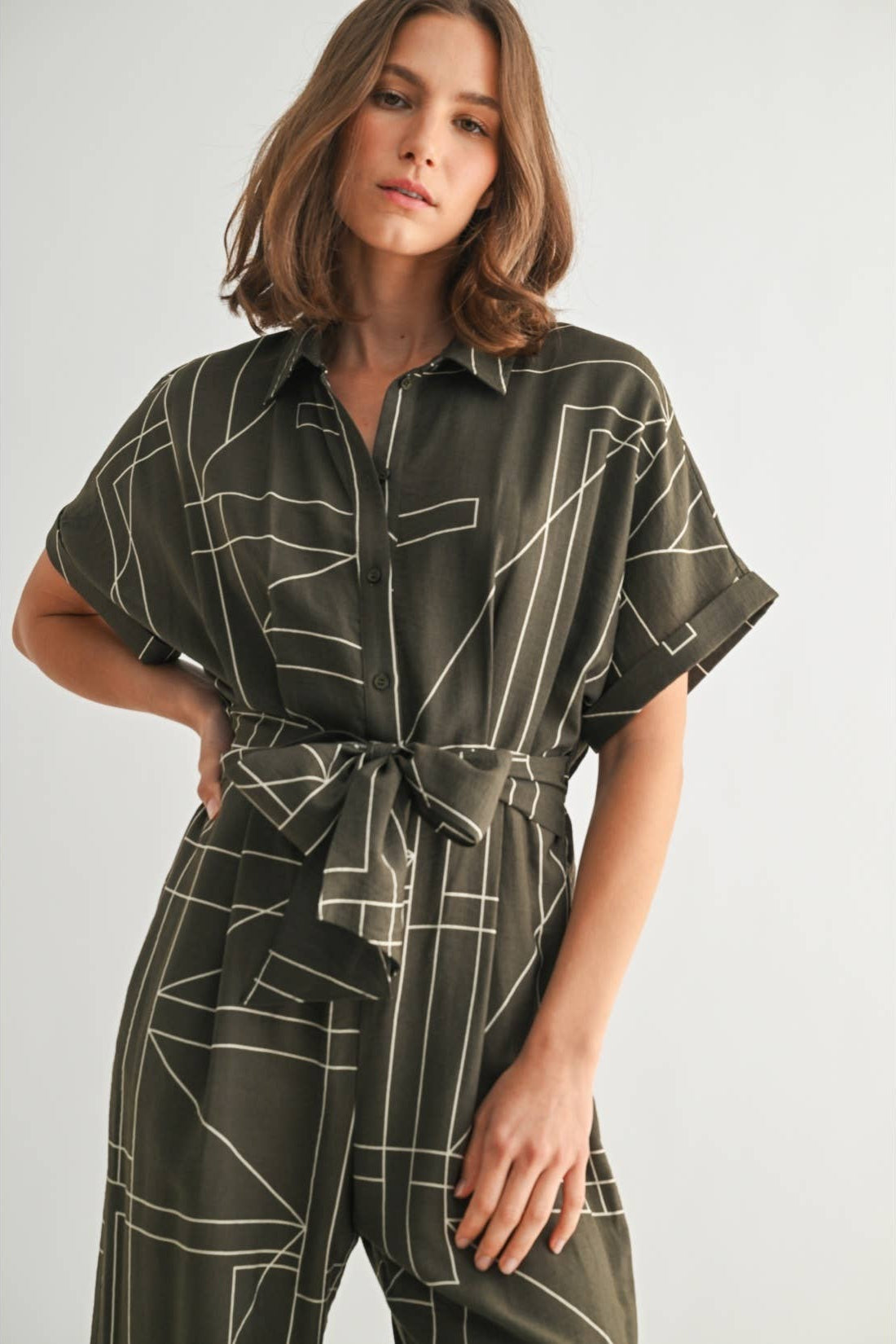 Women's geometric print olive jumpsuit with attached tie sash