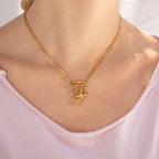 Woman wearing paperclip carabiner with charms