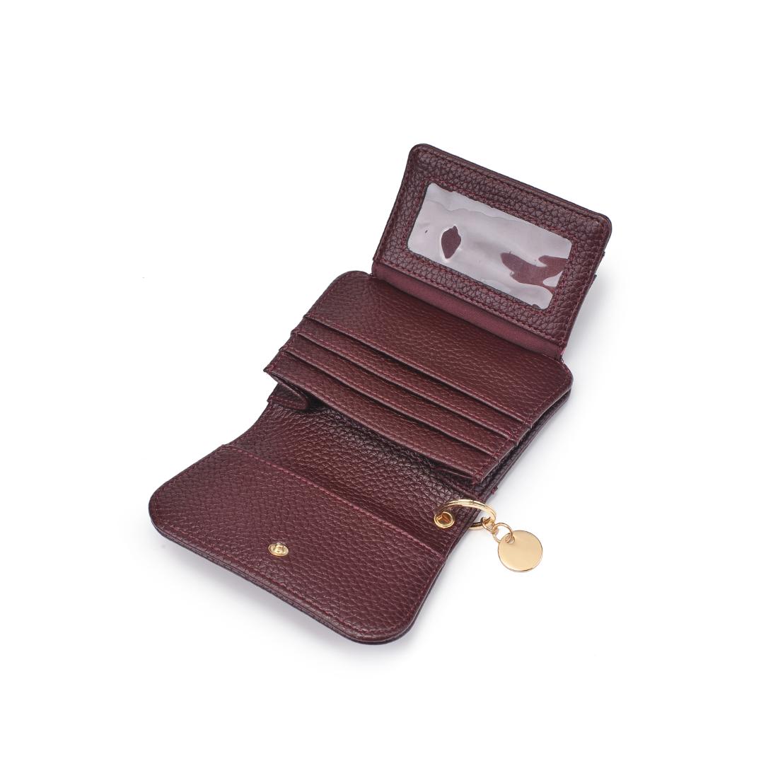 Interior of wine snap button wallet showing slots and ID compartment with key ring on white background