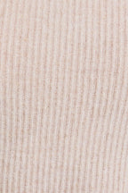 Close-up of oatmeal mock neck ribbbed knit fabric