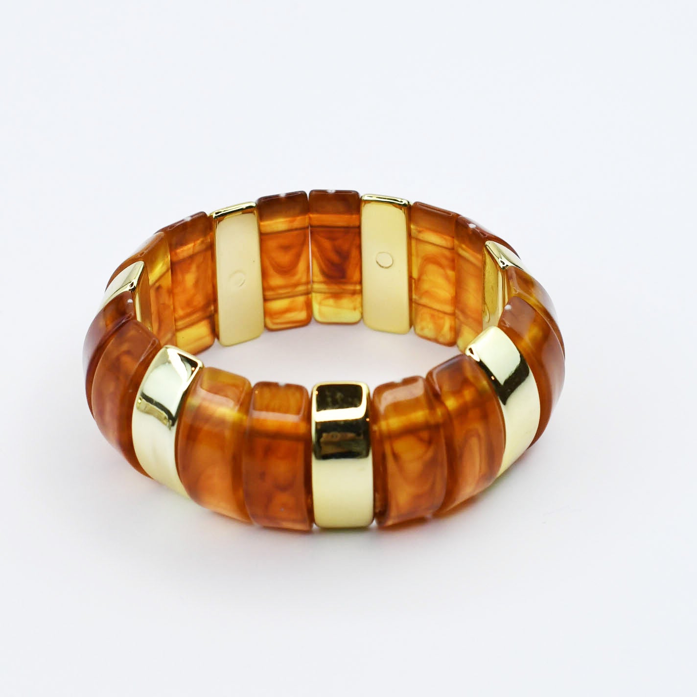 Brown beaded gemstone bracelet with gold accents on a white background