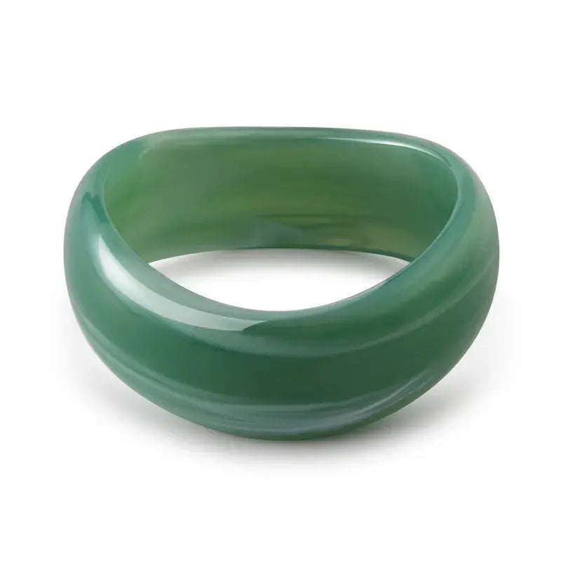 Women's green chunky bracelet on a white background