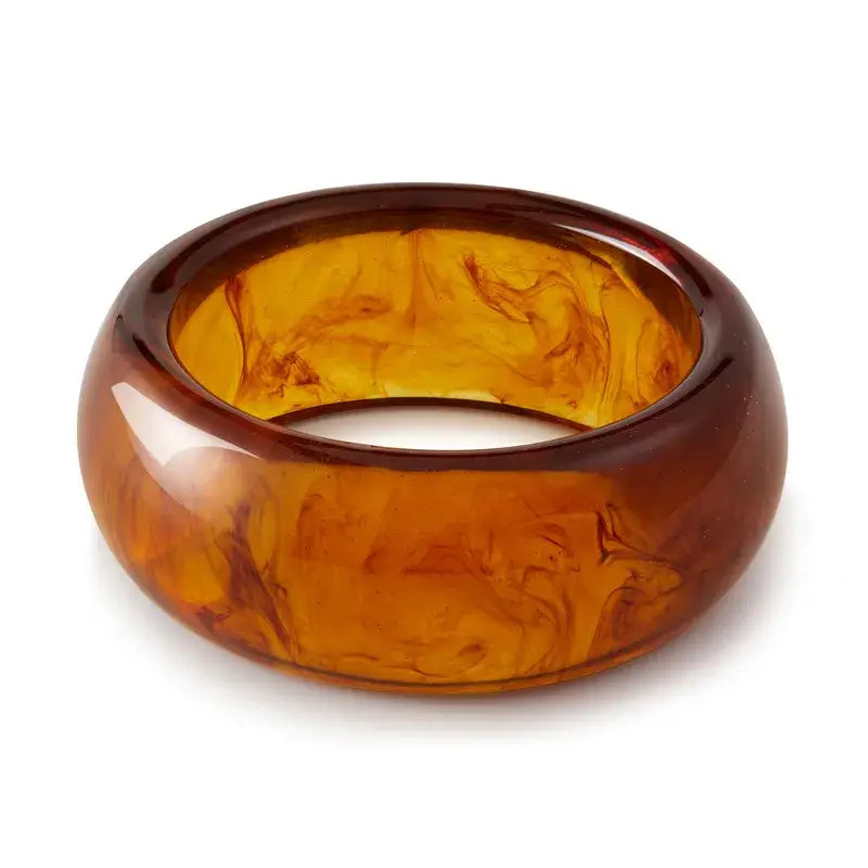 Women's tortoise shell chunky bracelet on a white background