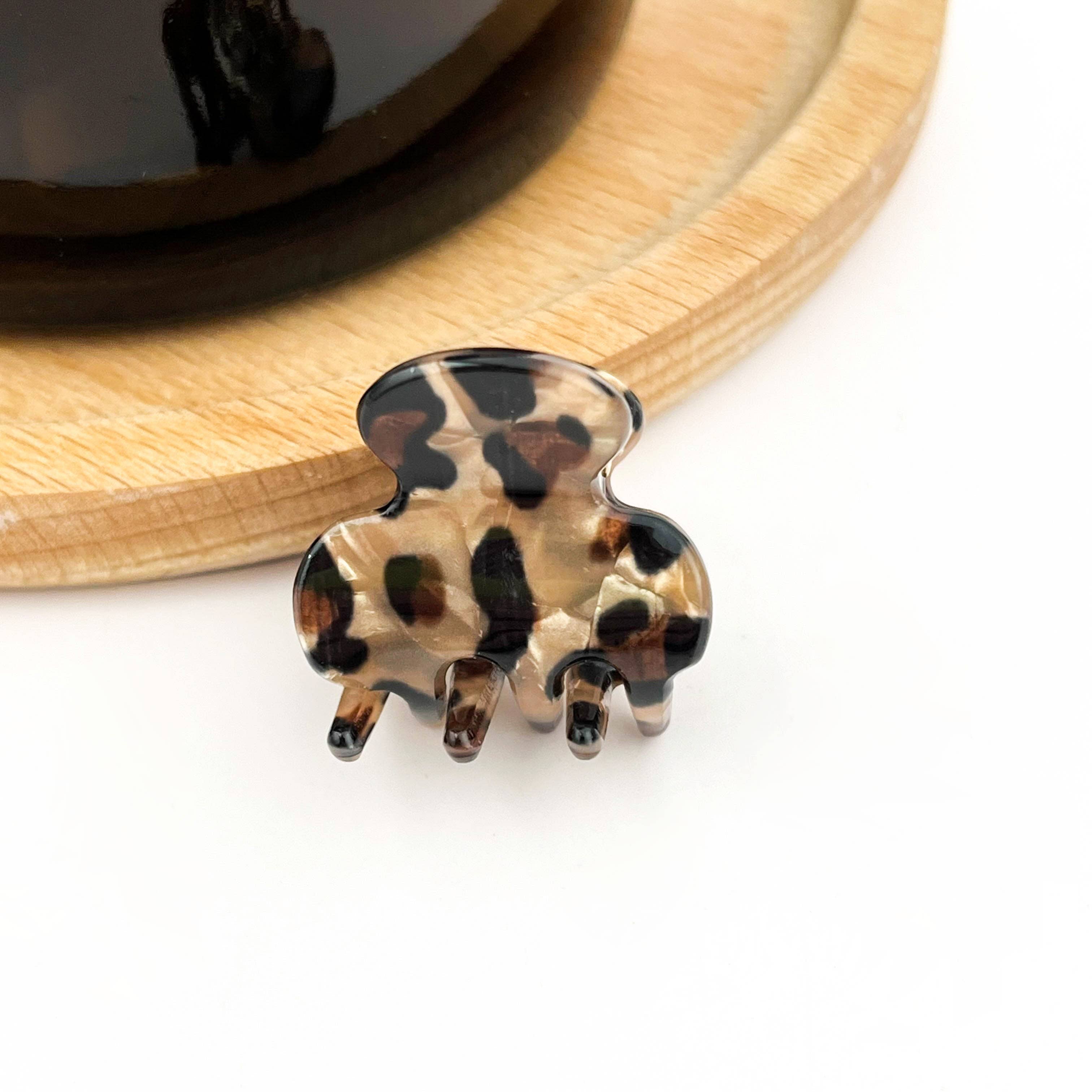 Leopard print hair clip on a white background