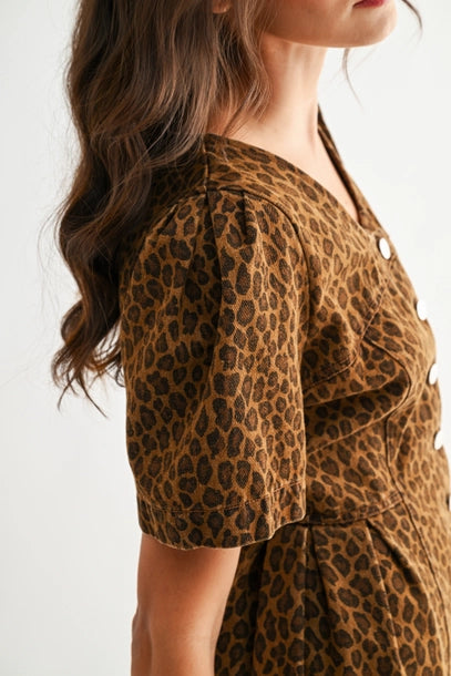 Leopard print dress worn by a person on a white background