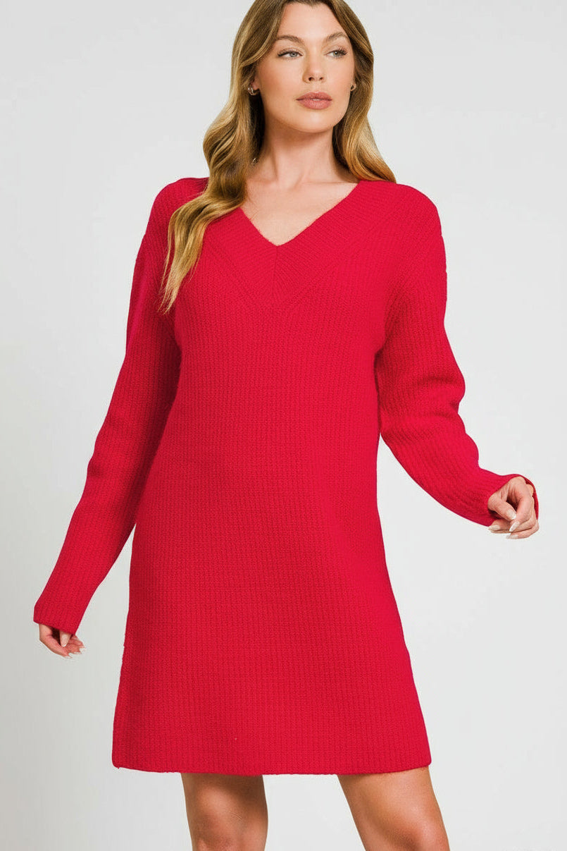 Woman wearing red sweater dress on white background
