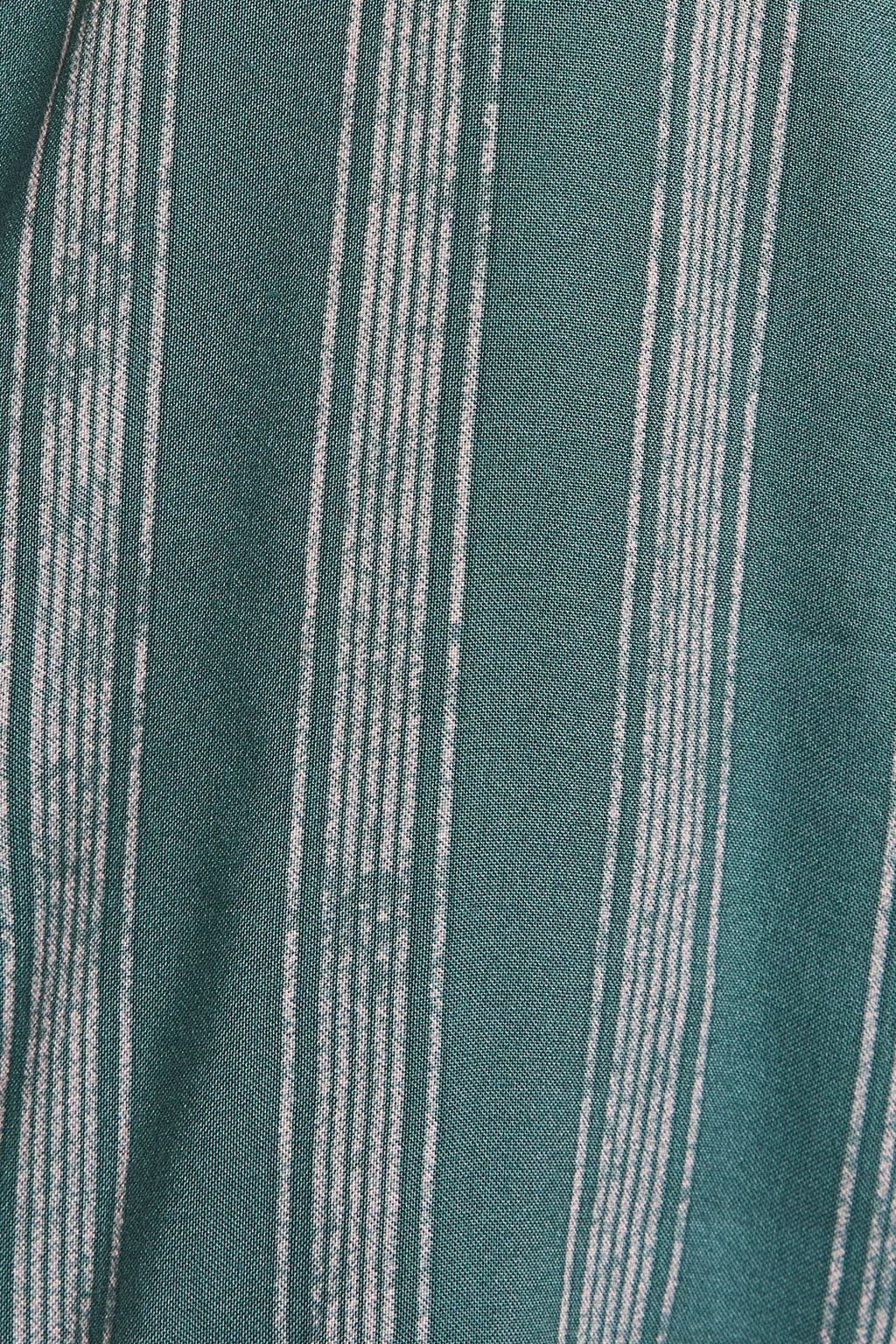 Close up of green and cream striped fabric 