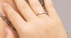 Woman wearing triple stone fluted stacing ring
