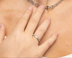 Woman wearing a triple CZ stone fluted band ring