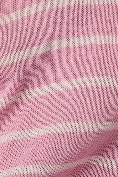 Close-up of the pink knit sweater fabric with light pink stripes