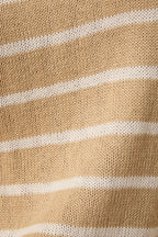 Close-up of tan knit sweater fabric  with cream stripes