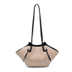 Natural straw bag with black strap on a white background