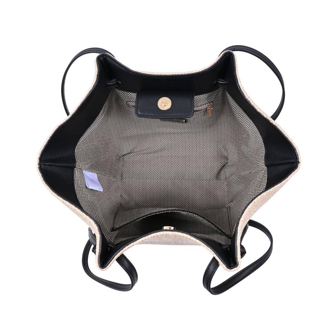 Inside fabric and pockets natural straw bag with black strap on a white background