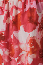Close-up of a orange, pink and cream floral patterned fabric