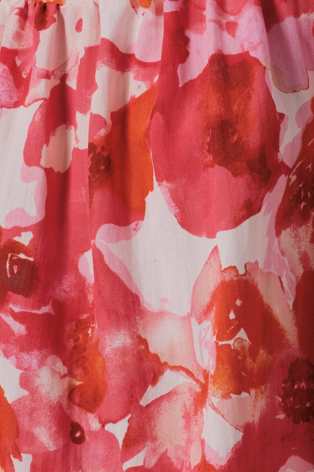 Close-up of a orange, pink and cream floral patterned fabric
