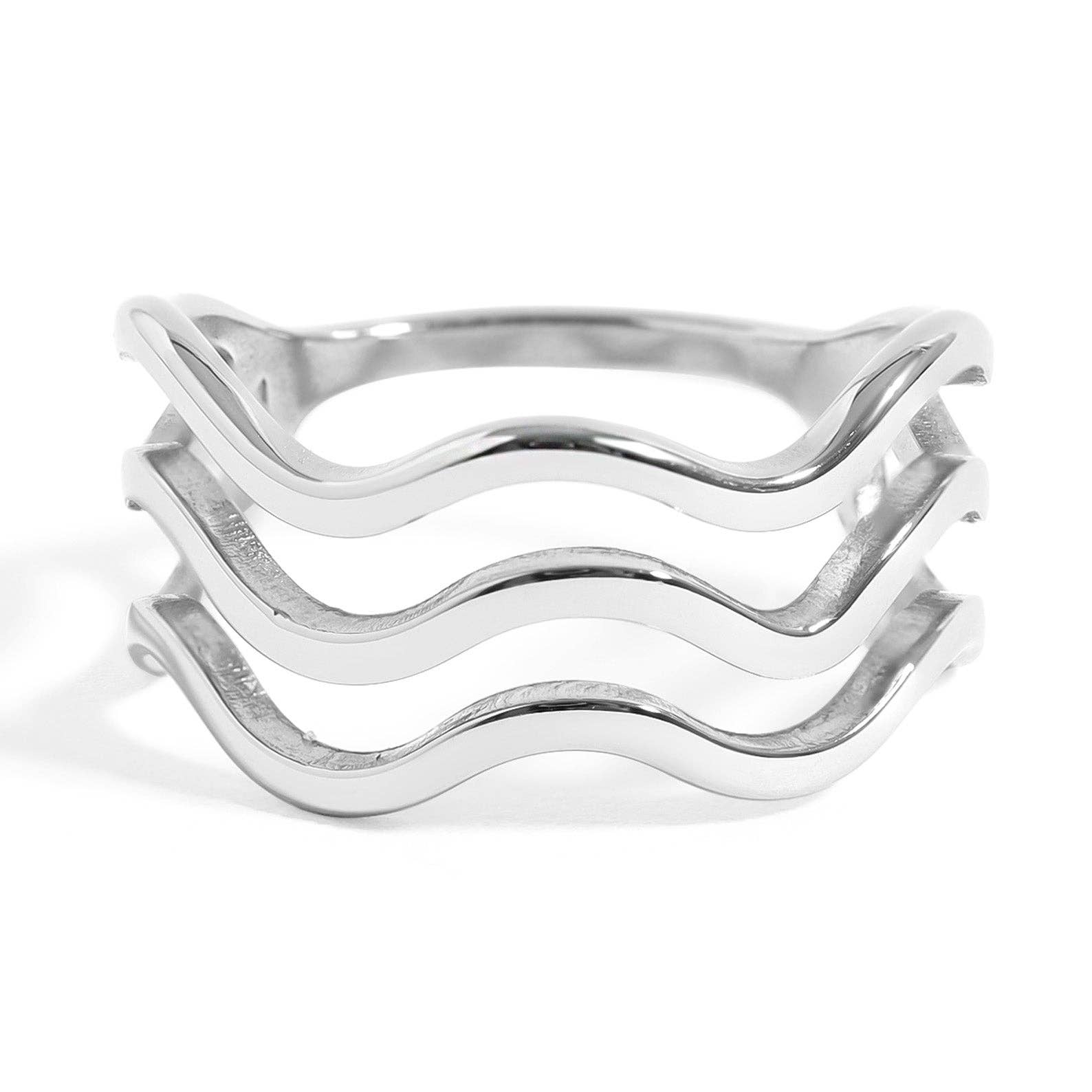 Silver ring with wavy design on a white background