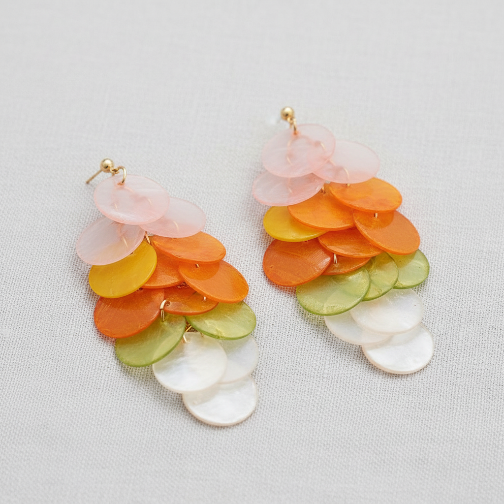 Colorful layered disc earrings on a light gray background