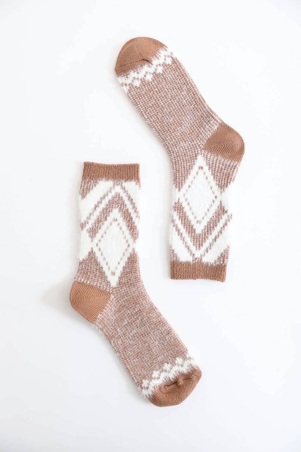 Pair of camel diamond pattern faux mohair socks on a white background
