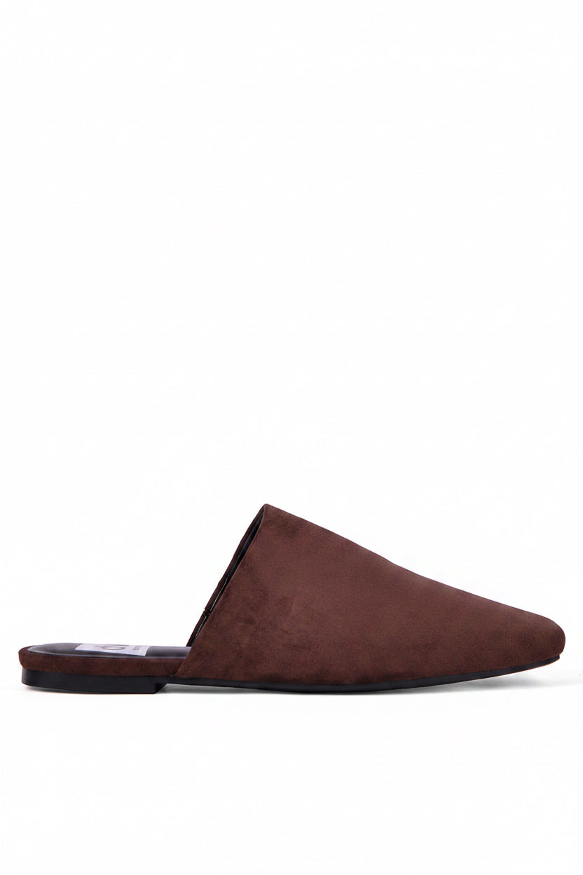 A brown suede mule flat shown from a side profile view against a solid white background.