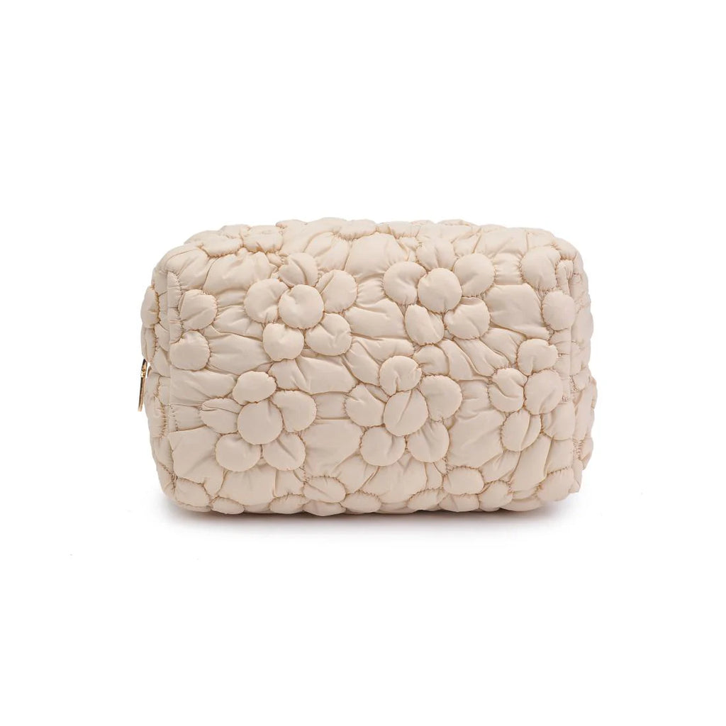 Cream-colored quilted floral design cosmetic bag with a gold zipper on a white background