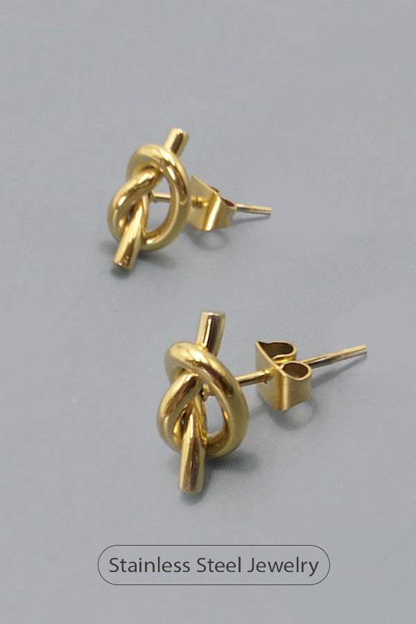 18k gold-plated stainless steel knot earrings on blue background