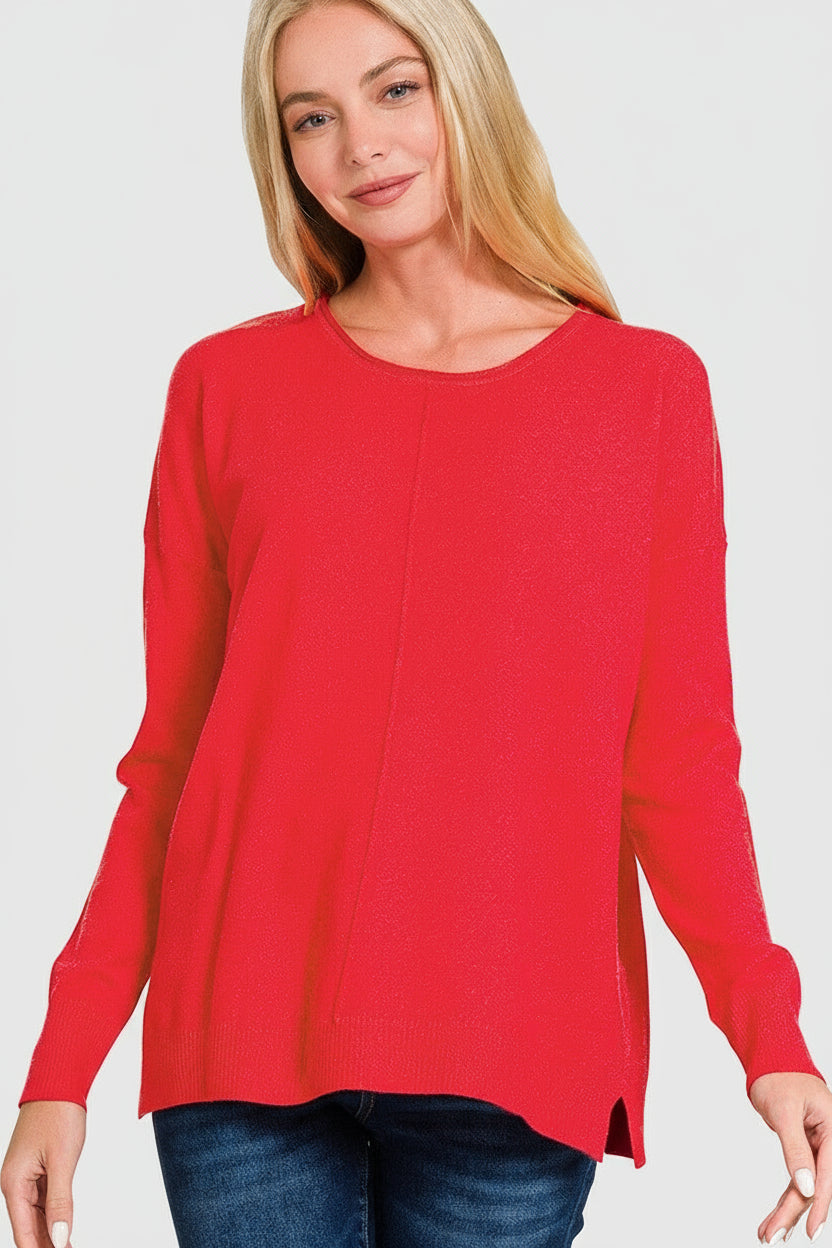 Woman wearing a red front seam sweater on a white background
