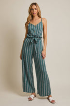 Woman wearing striped green and cream ruffle top pants with self tie