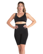 Women's black high-waisted firming thigh shaper on a white background