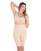 Woman wearing a nude high waist thight shaper on a white background