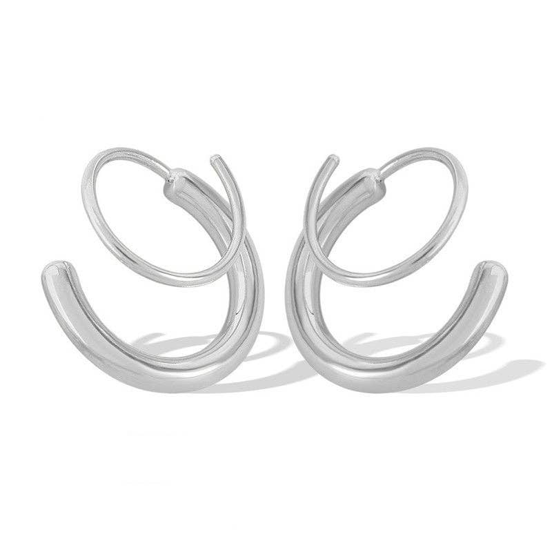 A pair of 18k silver-plated spiral hoop earrings shown on a clean, solid off-white background.