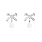 Stainless steel bow-shaped earrings with freshwater pearl on a white background