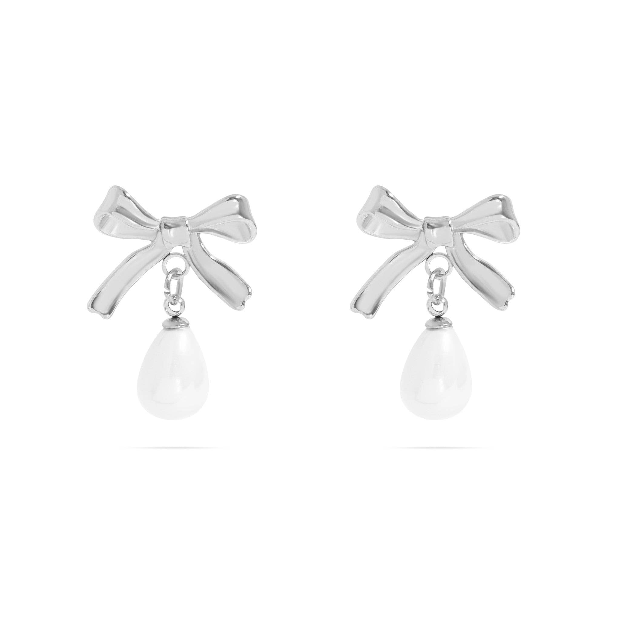 Stainless steel bow-shaped earrings with freshwater pearl on a white background