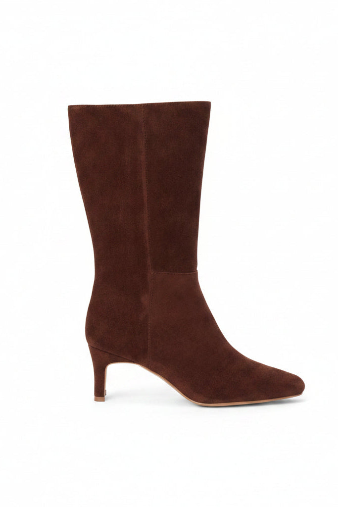 A slim kitten heel mid-calf brown suede boot shown from a side profile on a white background.