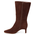 A slim kitten heel mid-calf brown suede boot shown from a side profile on a white background.