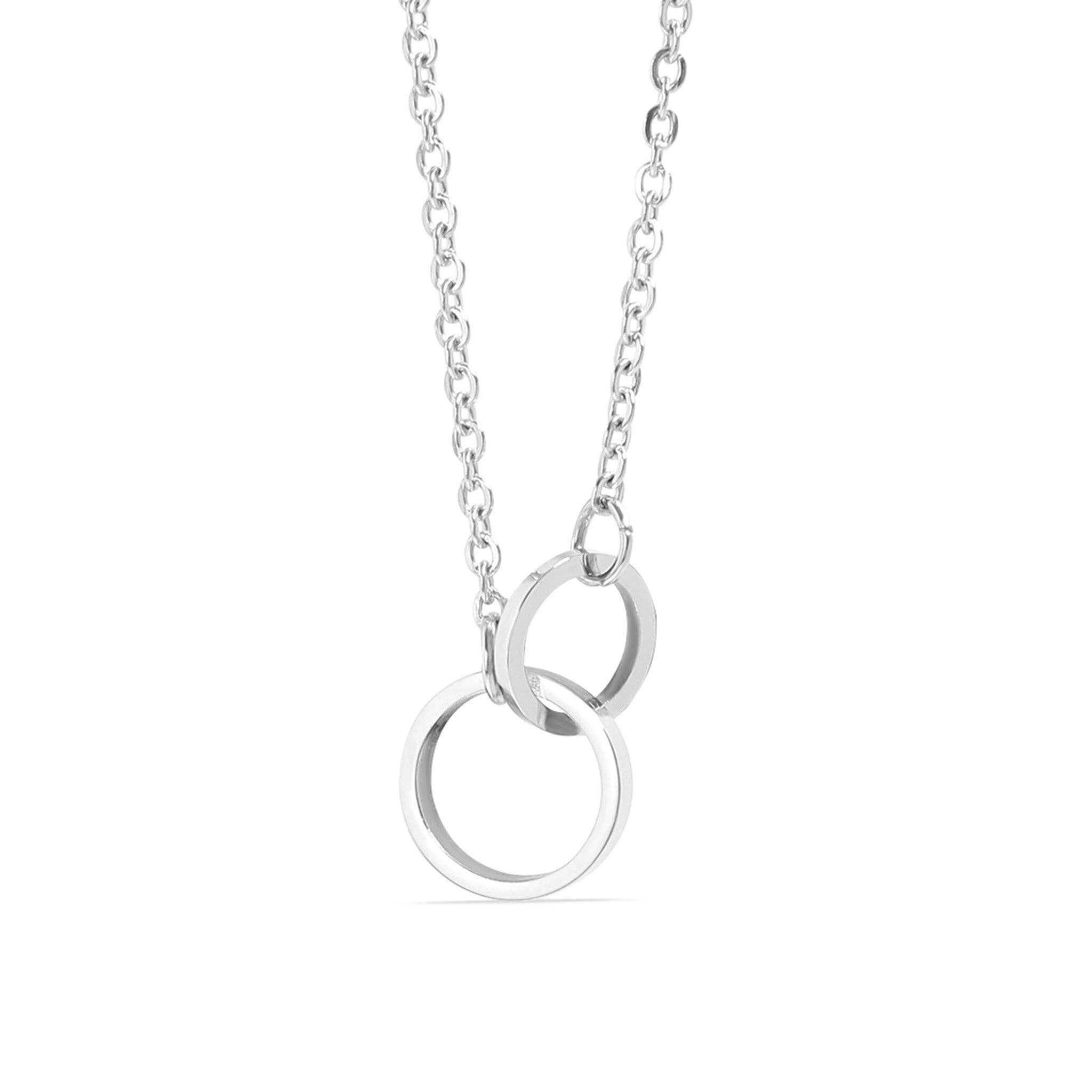 Silver necklace with two interlocking rings on a white background