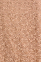 Close-up of taupe lace fabric 