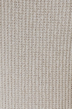 Close-up of natural tone boucle showing the detailed texture.