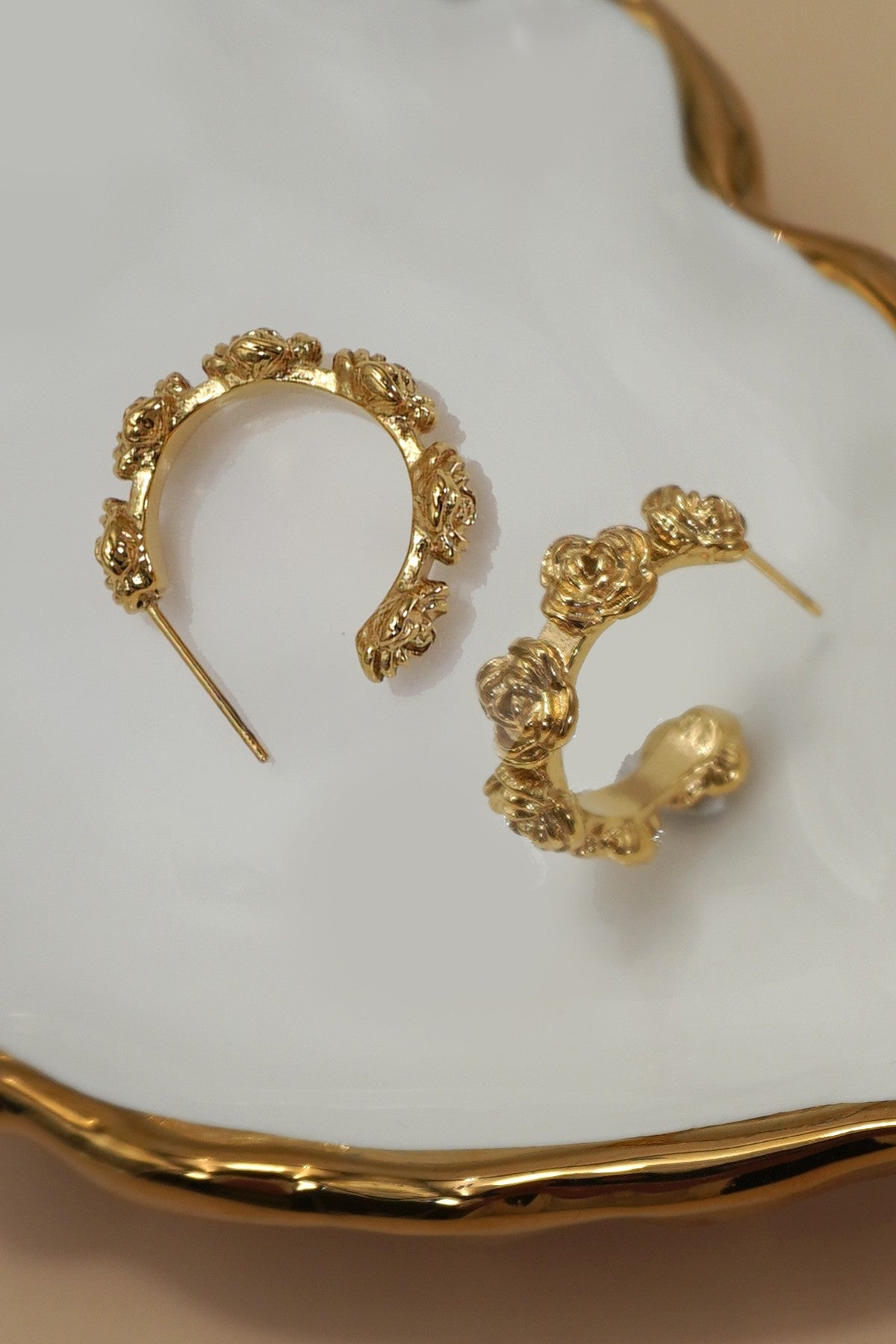 18k gold-plated stainless steel floral design hoop earrings on white background