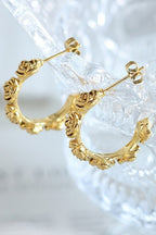 18k gold-plated stainless steel floral design hoop earrings on clear background