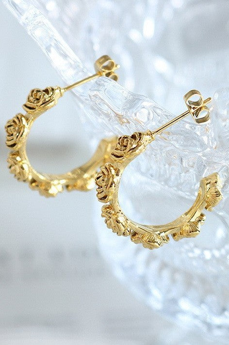 18k gold-plated stainless steel floral design hoop earrings on clear background