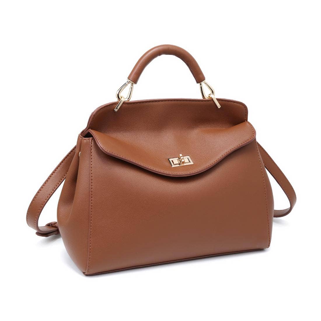 Brown vegan leather handbag/crossbody with curved flap and gold hardware on a white background