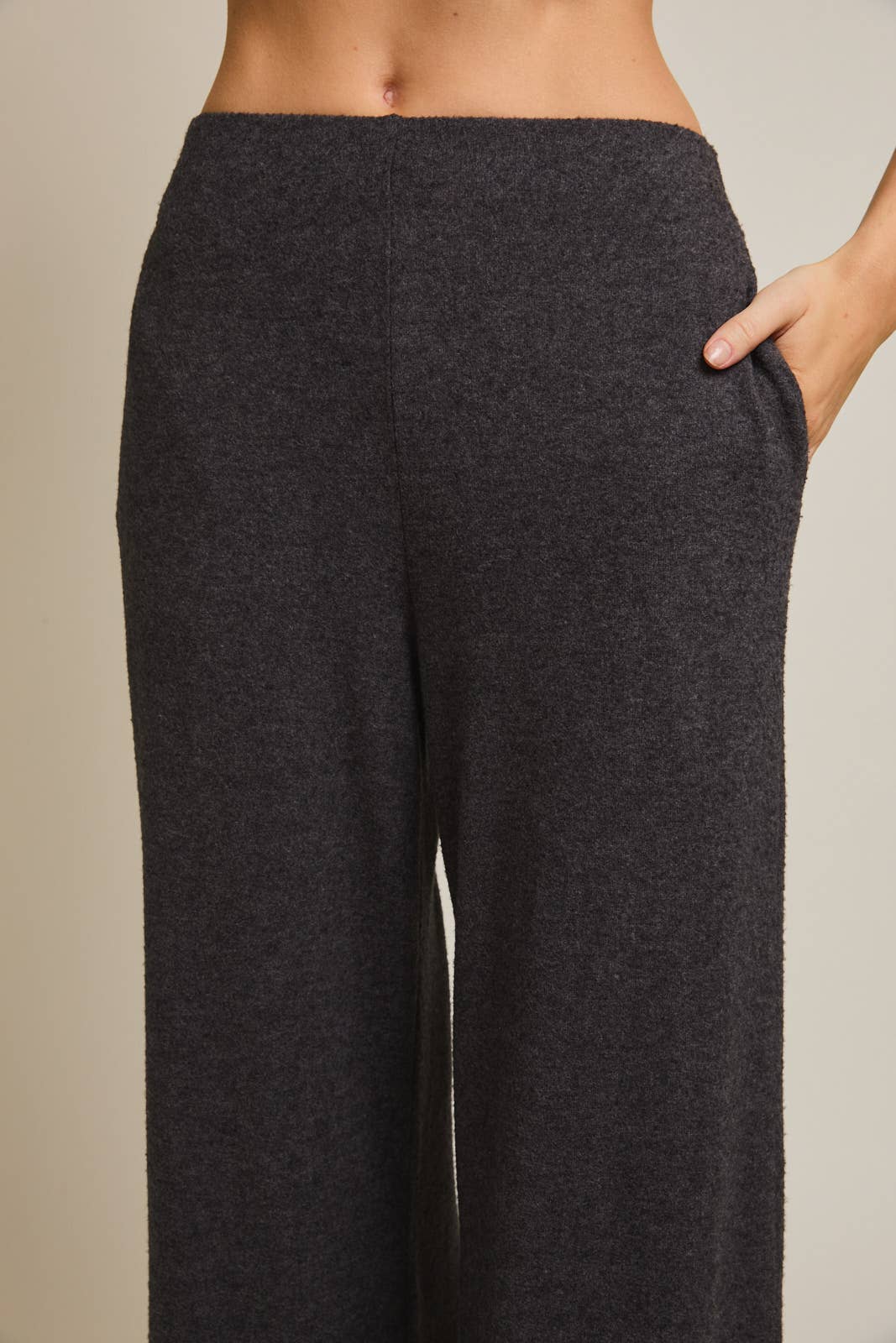 Heather gray pants worn by a person on a neutral background
