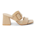 Sand color sandal with a block heel and double strap with statement buckle on a white background